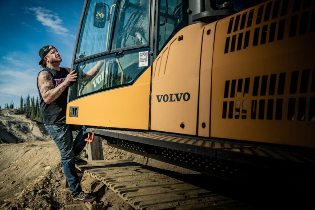 Rick-Ness-climbing-into-Volvo-excavator-cab-2048x1366